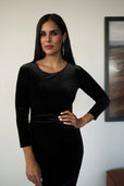 Woman wearing long sleeve velvet work dress