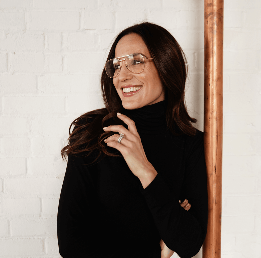 Woman wearing black long sleeve turtle neck