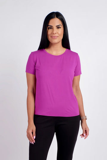 Woman wearing magenta short sleeve work tshirt