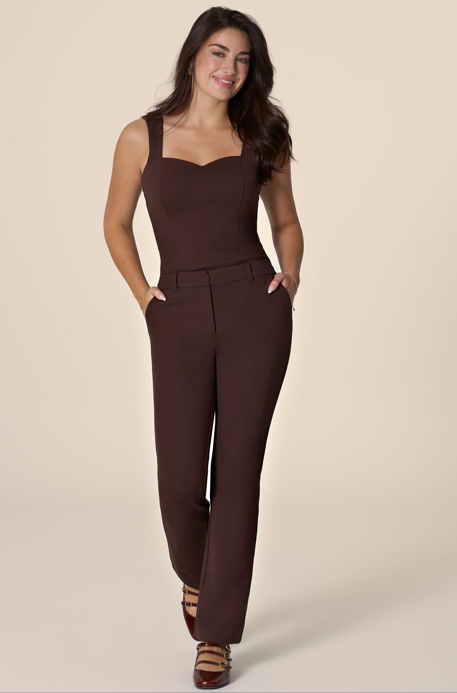 Woman wearing a brown top