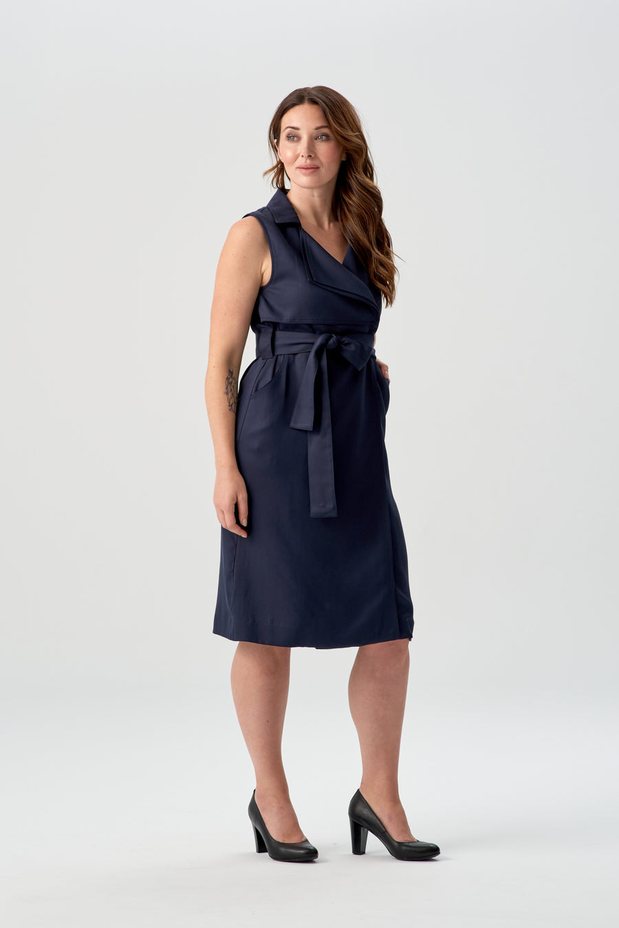 woman wearing navy blue vest dress