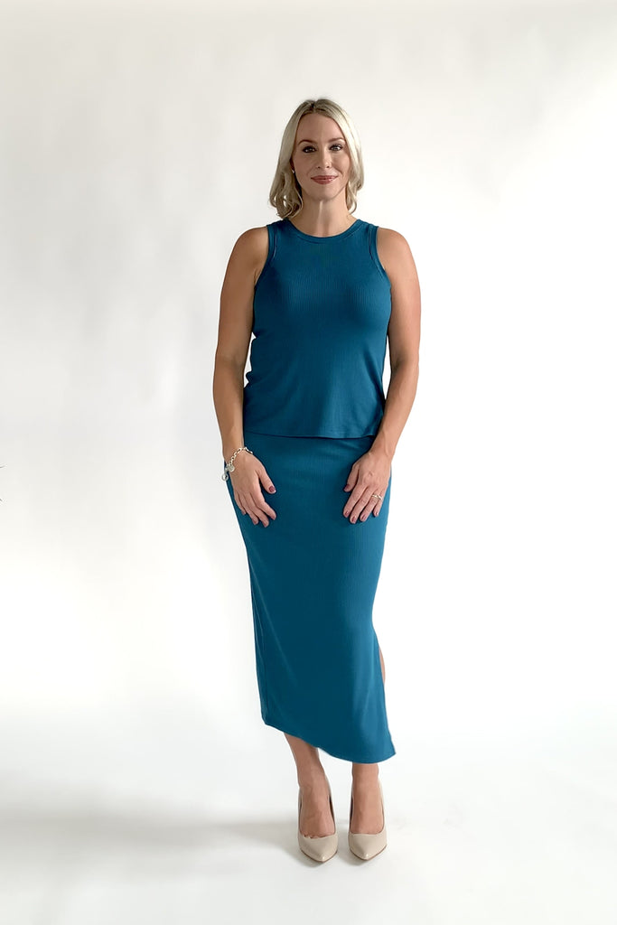 woman wearing turquoise workwear outfit