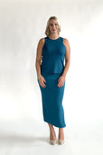 woman wearing turquoise workwear outfit