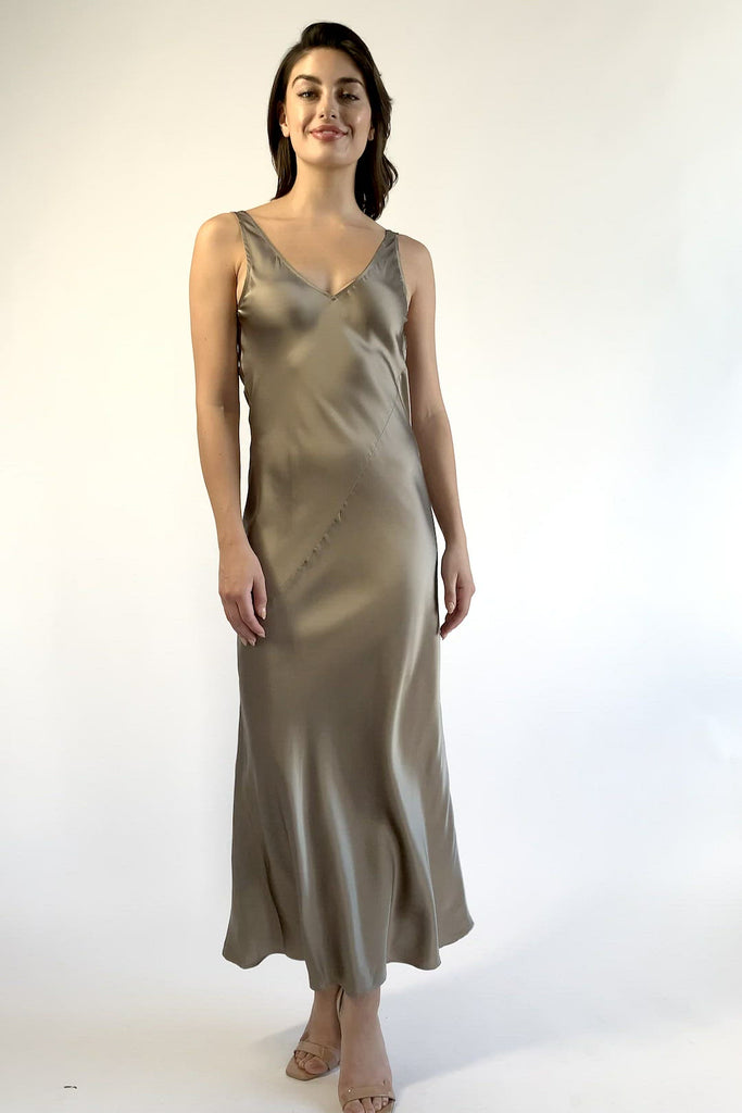 woman wearing sleeveless silk maxi dress