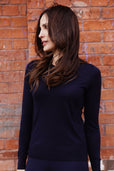 woman wearing navy blue sweater