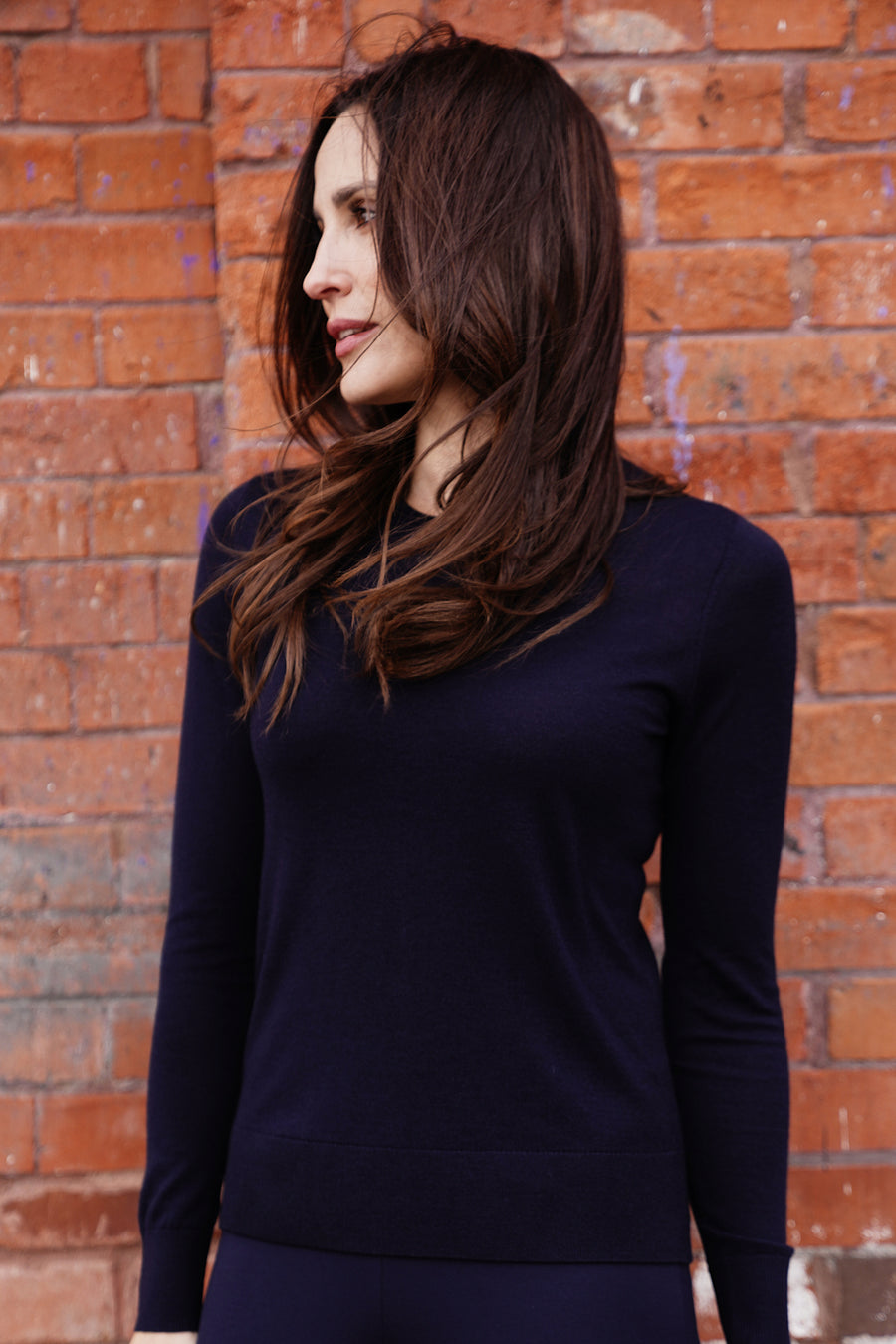 woman wearing navy blue sweater