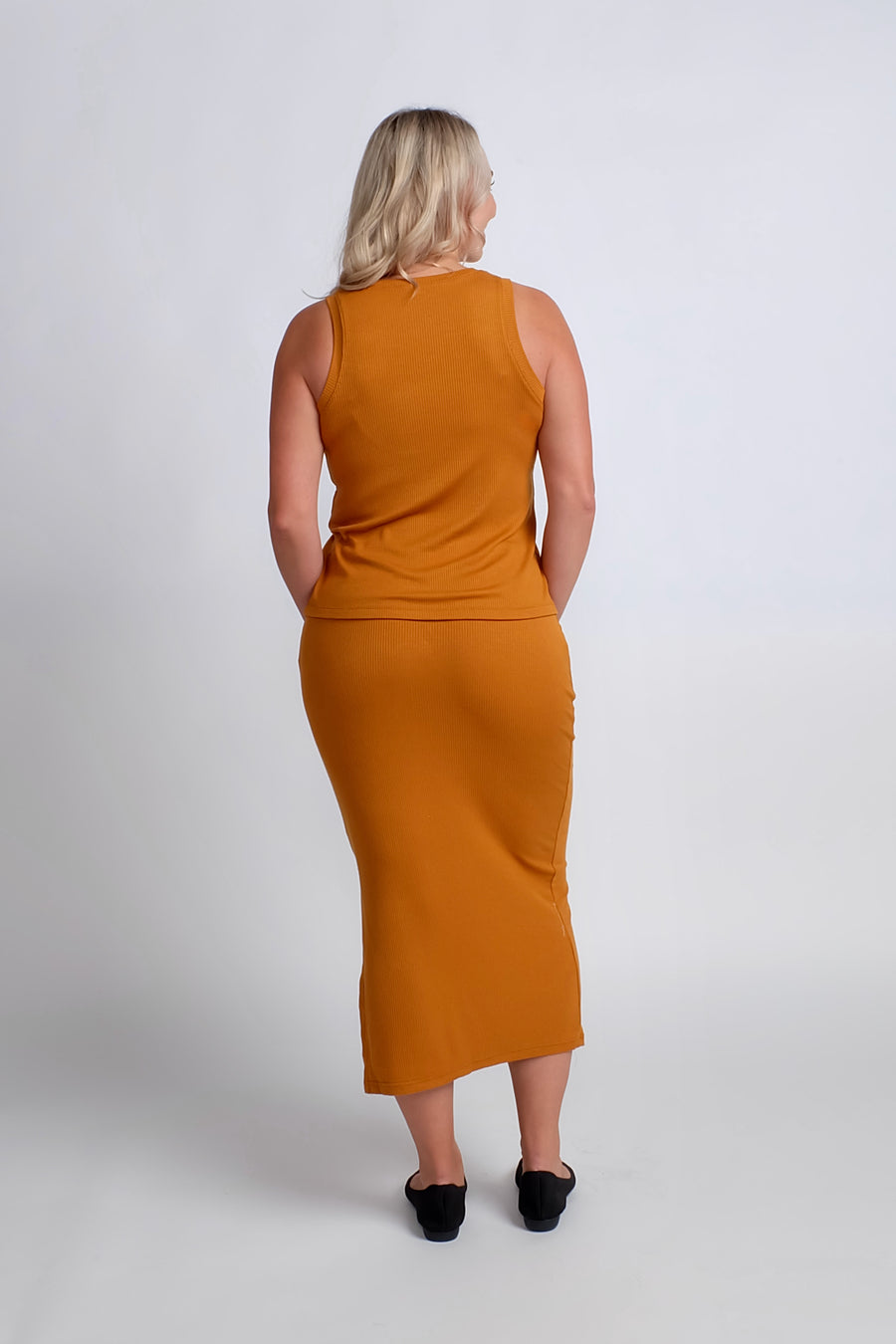 woman wearing casual work set in orange
