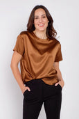 Woman wearing copper short sleeve silk work top