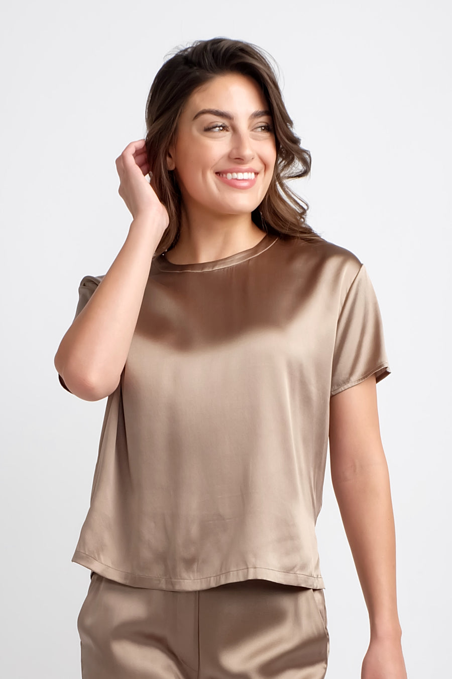 woman wearing short sleeve silk top