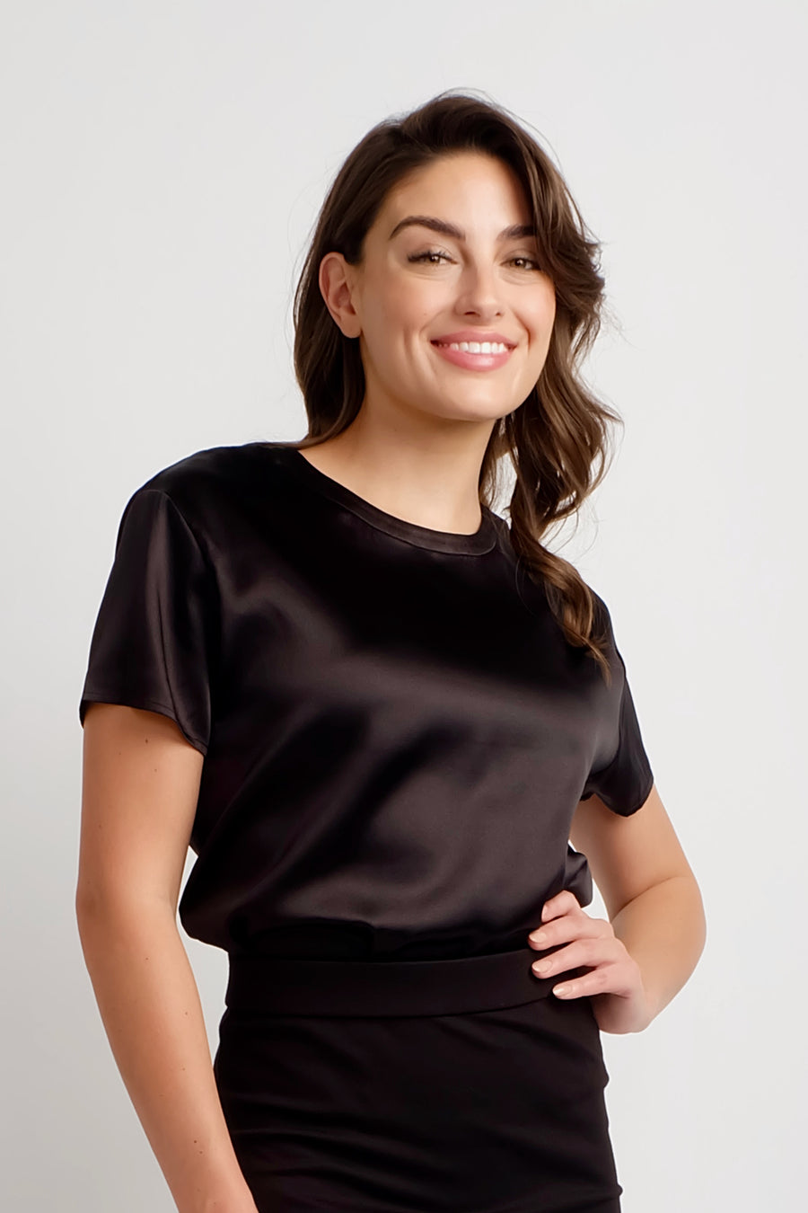 woman wearing short sleeve black silk top