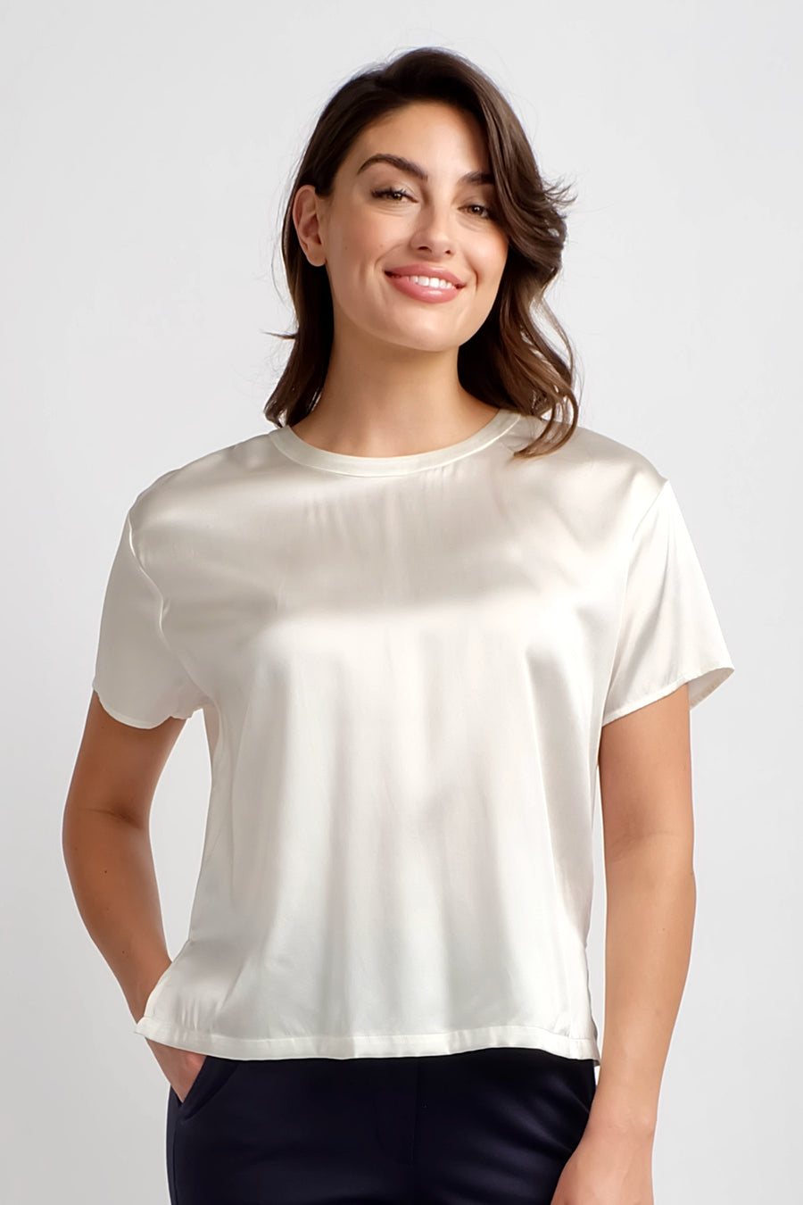 woman wearing short sleeve silk ivory top