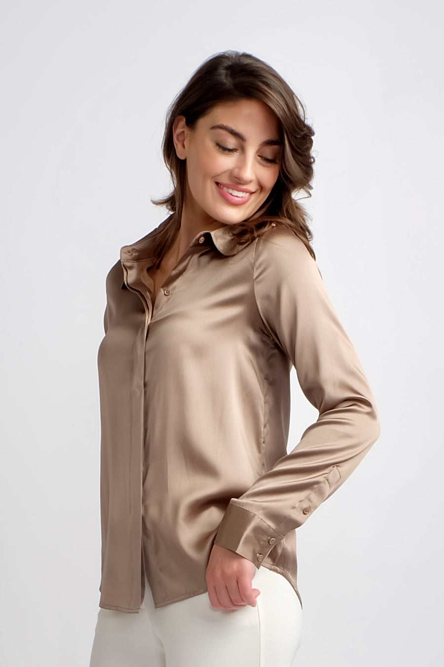 woman wearing long sleeve button up silk top