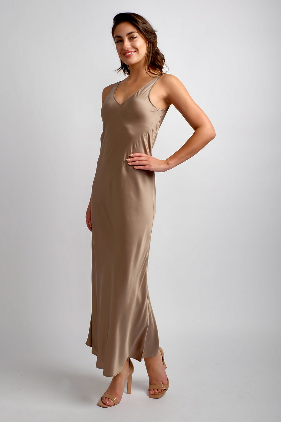 woman wearing sleeveless silk maxi dress