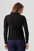 woman wearing black cardigan with navy blue pant