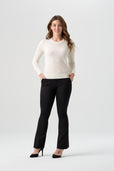 woman wearing white cardigan with black pants
