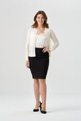 woman wearing white button up cardigan with black pencil skirt