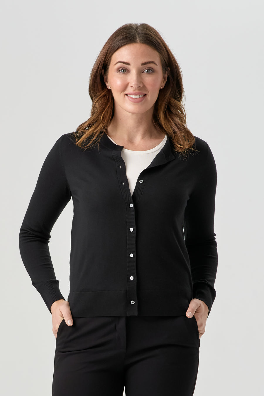 woman wearing black button up cardigan with black pant