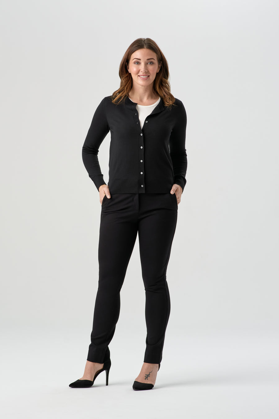woman wearing black button up cardigan with black pant