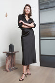 woman wearing black silk work outfit