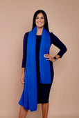 woman wearing black work dress with blue scarf