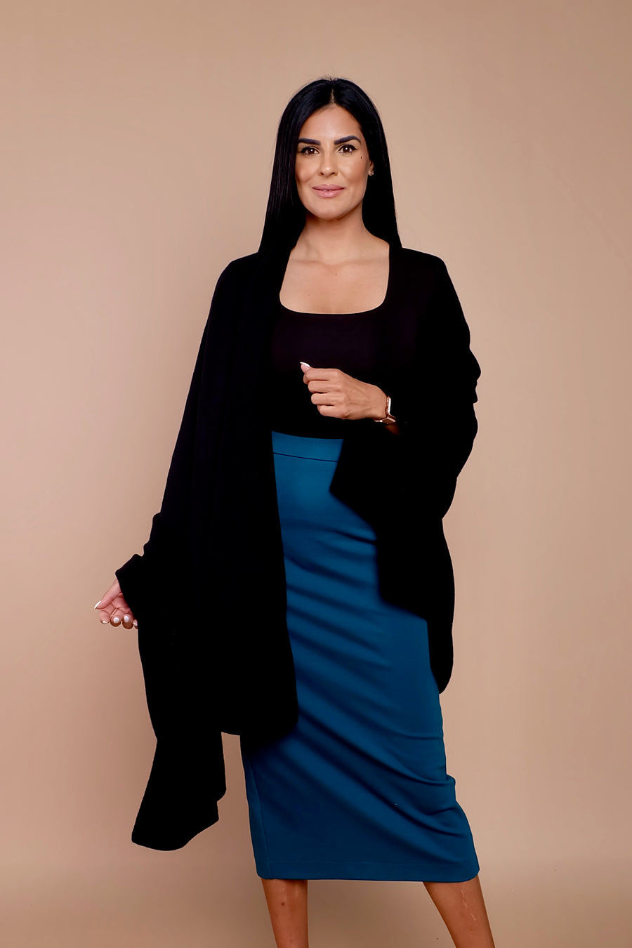 woman wearing blue pencil skirt with black sweater