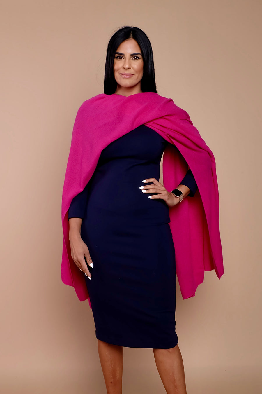 woman wearing navy blue work dress with pink sweater