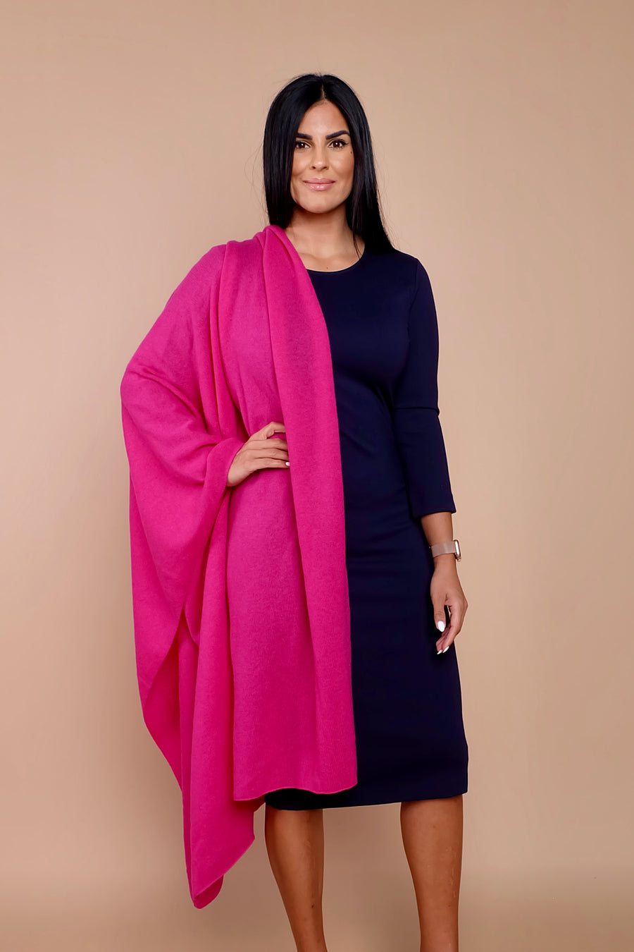 woman wearing navy blue work dress with pink sweater